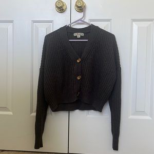 Dark gray sweater. Size medium. Brand love change.